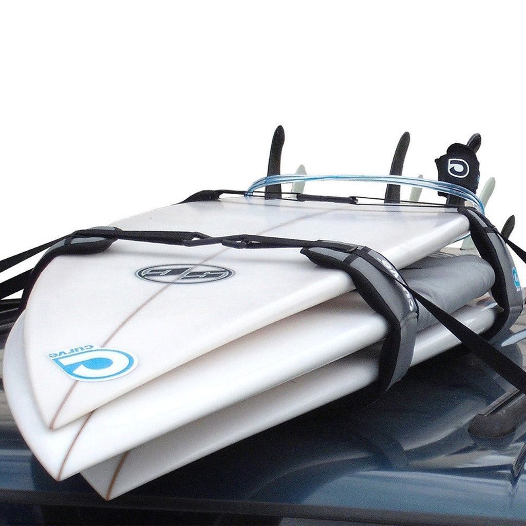 Various roof rack systems securely holding multiple surfboards on a car