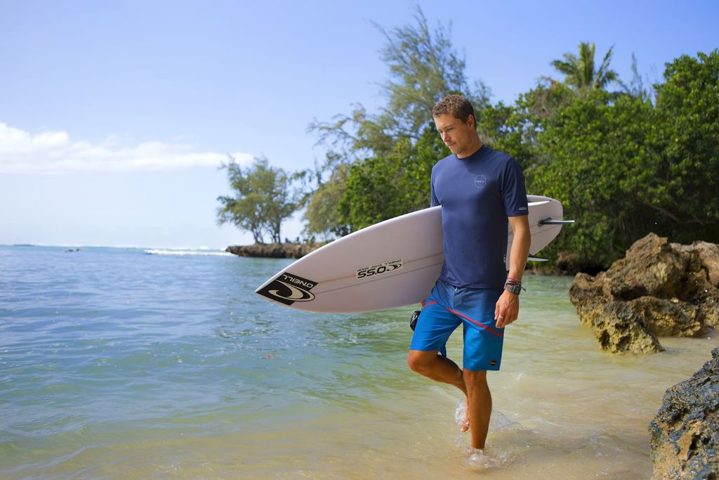 Different men’s rash guards displayed for choosing the best surfing gear