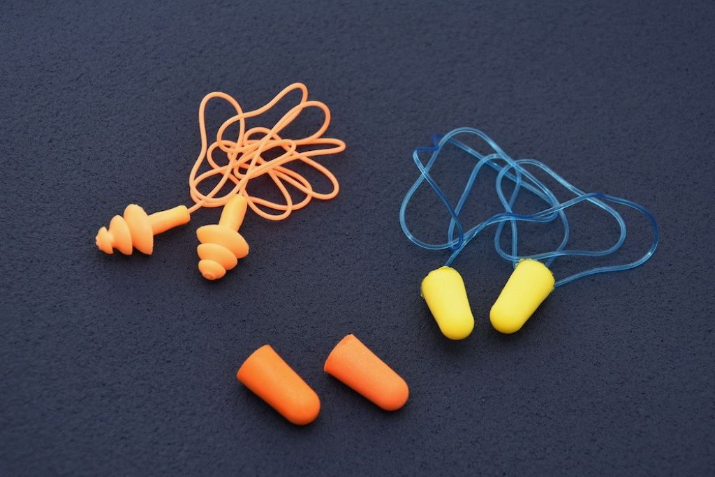 Close-up of waterproof surf ear plugs designed for protecting ears during surfing