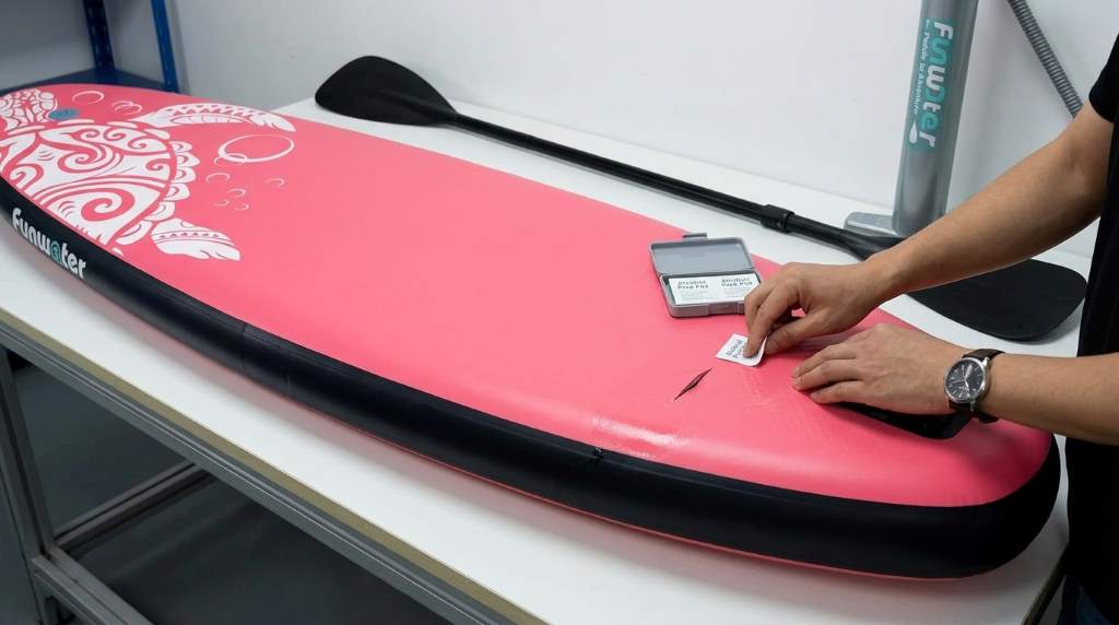 Soap bubble leak test on an inflatable paddle board